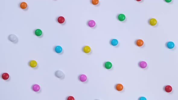 Rotating White Background with Multicolored Candies