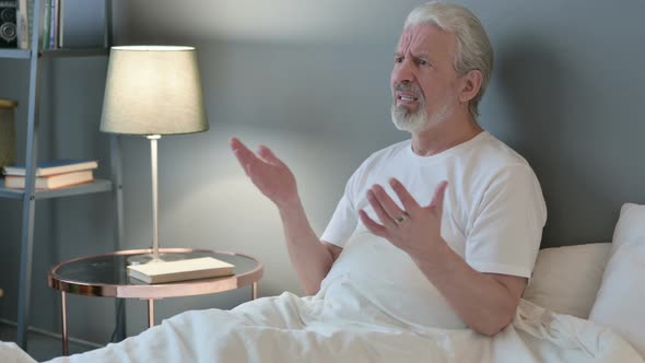 Angry Old Man Feeling Disappointed in Bed  alt