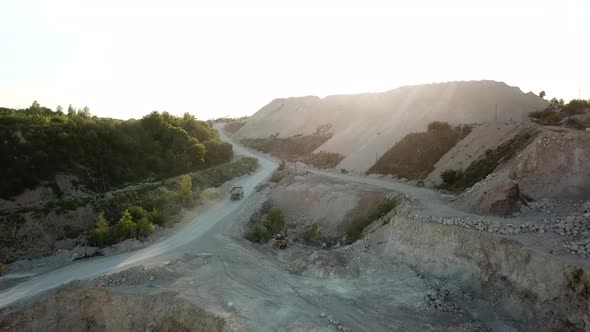 Bulldozer excavator truck, heavy duty digging stone, quarry, stone work, air view alt