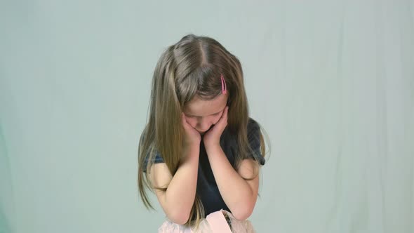 Portrait of Child Girl Trying to Remember Something Making Innocent I Don't Know Expression alt