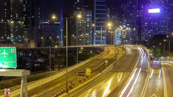 Timelapse Illuminated Hong Kong Road Against Cityscape alt