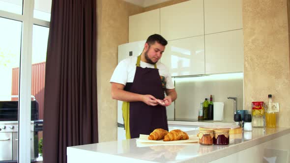 Man Preparing Steak in a Kitchen