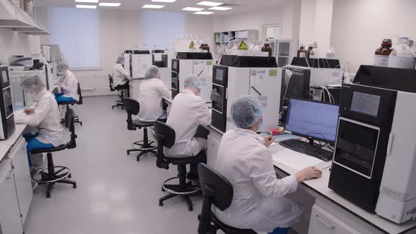 Pharma Workers During the Daily Working Process in the Laboratory