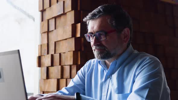 Winner Senior Male Person Feeling Happy at Remote Workplace alt