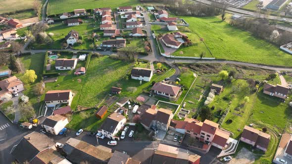 Aerial View of Suburban Landscape with Private Homes Between Green Fields in Quiet French alt