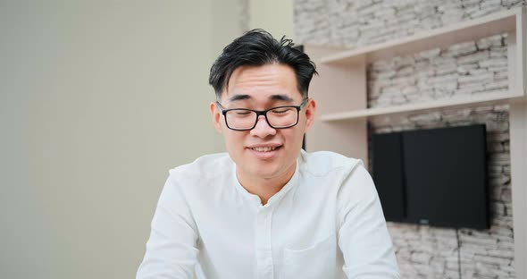Serious Guy in Glasses and White Pullover Talks To Employer