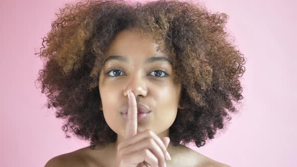 Professional Model Raises Finger Showing Silence Gesture alt