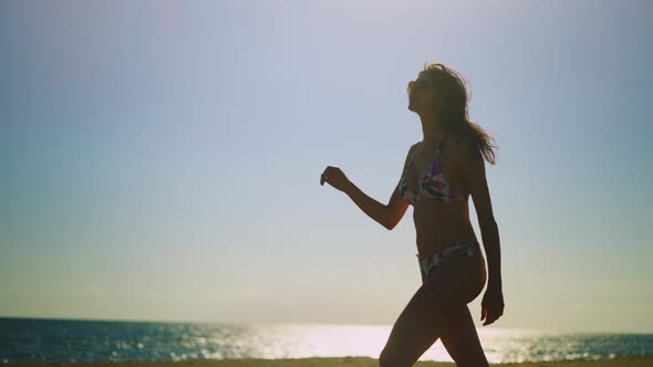 Attractive tanned woman in bikini