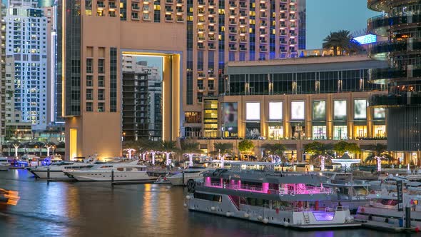 View of Dubai Marina Towers and Canal in Dubai Day to Night Timelapse alt