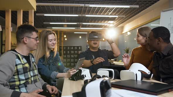 Young Hipster Man in Virtual Reality Glasses Having Fun Playing Game alt