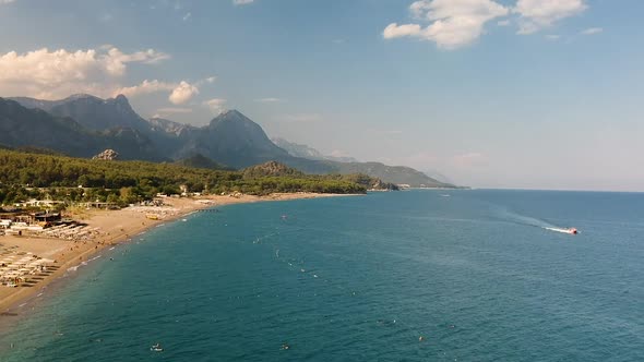 Aerial drone shot of the ocean, beach and mountain coast in Antalya, Kemer, Turkey