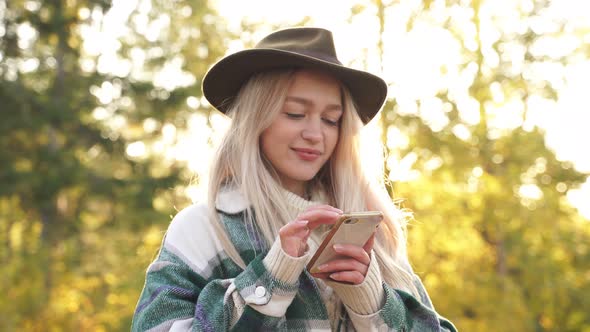 Adorable Caucasian Woman Rest on Mountains Use Smartphone