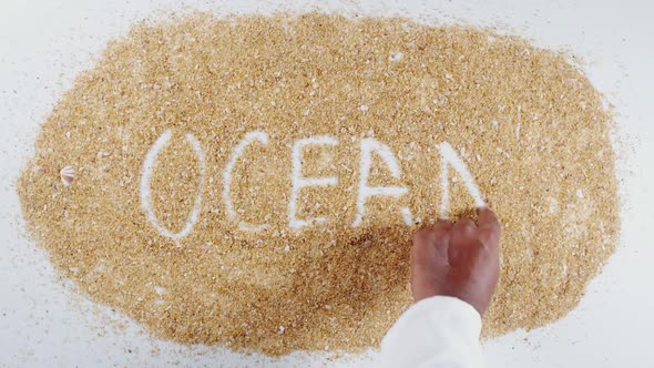 Hand Writes On Sand Ocean