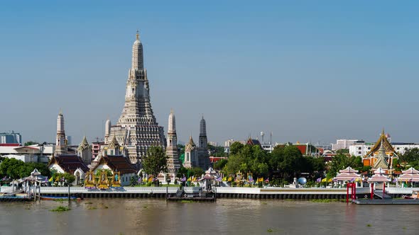 time lapse of Wat Arun Temple with Chao Phraya river in Bangkok, Thailand