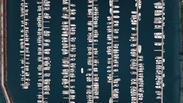 Top Down Slow Motion Sail Yacht at Port Aerial alt