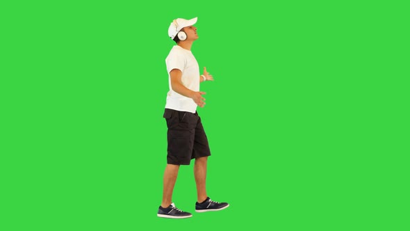 Happy Athlete Guy Walk Dance Listening to Cheerful Music in Headphones Joyful Sportive Man Cheering