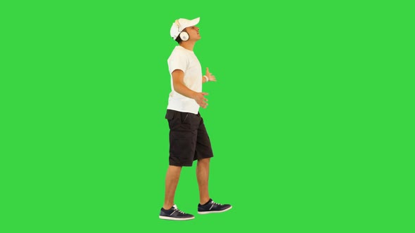 Happy Athlete Guy Walk Dance Listening to Cheerful Music in Headphones Joyful Sportive Man Cheering alt