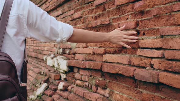 Japanese backpacker female enjoy her journey at amazing landmark in traditional city. alt