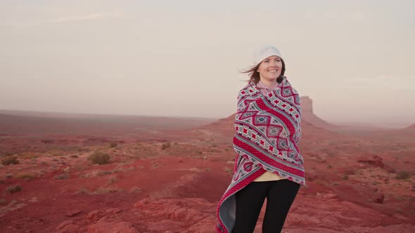 Portrait of Beautiful Young Woman Smiling Charmingly in Red Desert Landscape alt