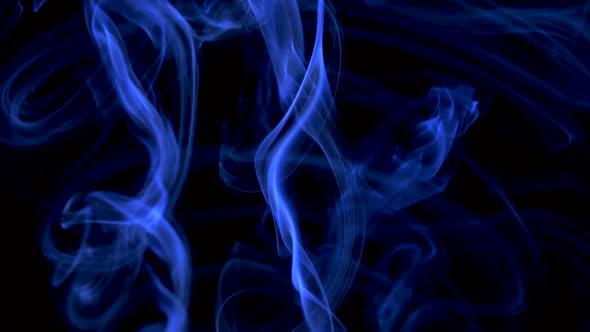 Abstract Smoke Cloud in the Form of a Spiral. Blue Smoke Slowly Floating Through Space Against Black alt