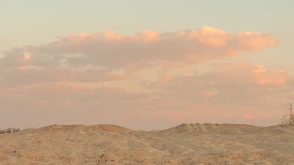 Сlouds at Sunset Over the Sand Desert