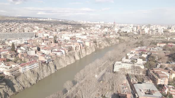 Aerial view of Metekhi church in old Tbilisi located on cliff near river Kura. Georgia 2021 Spring alt