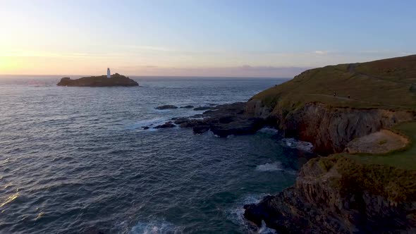 Aerial view of Godrevy point lighthouse at seaside in Cornwall at sunset