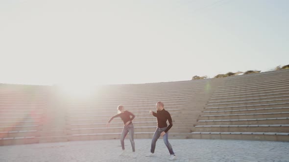 Man and woman couple dancers at outdoor theater alt
