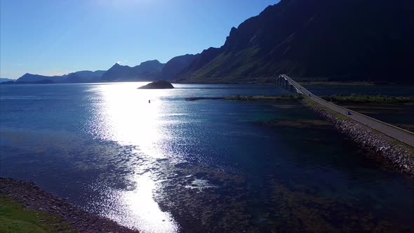Flying by Gimsoystraumen bridge on Lofoten islands in Norway alt
