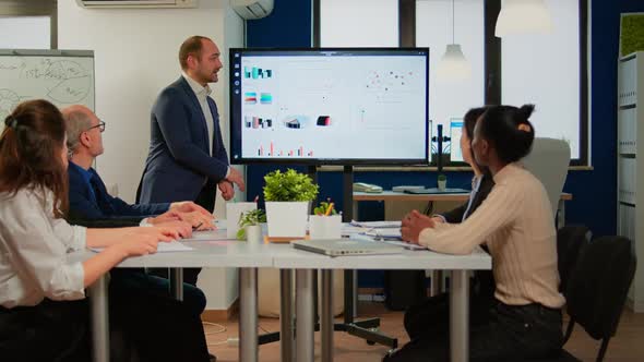 Succesful Business Man Presenting the Good Evolution of Company alt