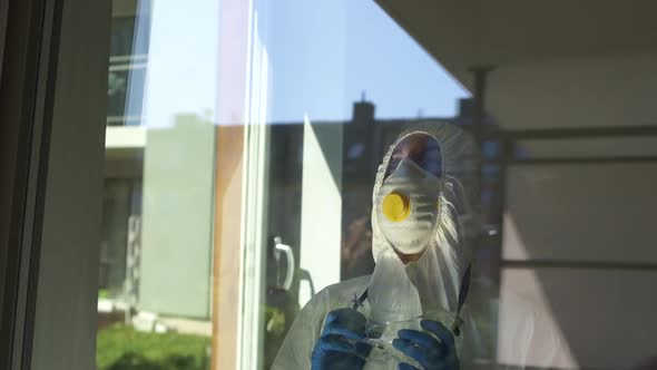 Portrait of an Exhausted Female Doctor in a Protective Suit with a Feeling of Despair on Her Face alt