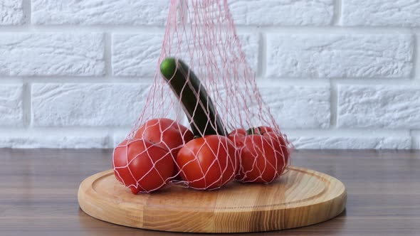 A Woman Brought Organic Vegetables From a Nowaste Eco Store with a Mesh Bag
