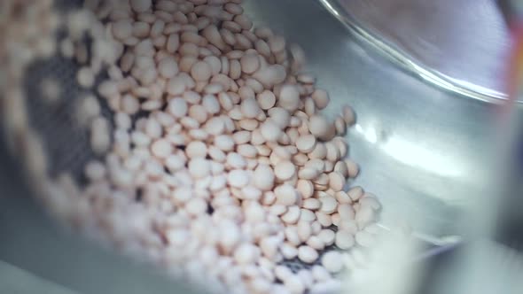 Spinning Tablets on Pharmaceutical Conveyor Factory Spbd alt