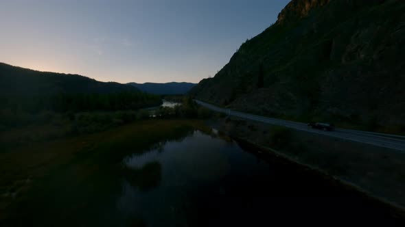 FPV Sports Drone Chase Black SUV Automobile Night Natural Mountain Valley alt