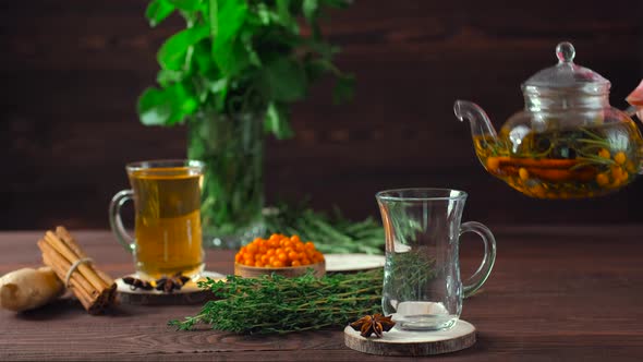 Pouring Hot Herbal Tea With Sea Buckthorn