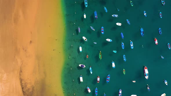 Aerial View of the Golden Sand of the Beach Las Teresitas and Colorful Boats Moored Alongside alt