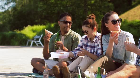 Friends Hiking and Having Picnic on Lake Pier alt