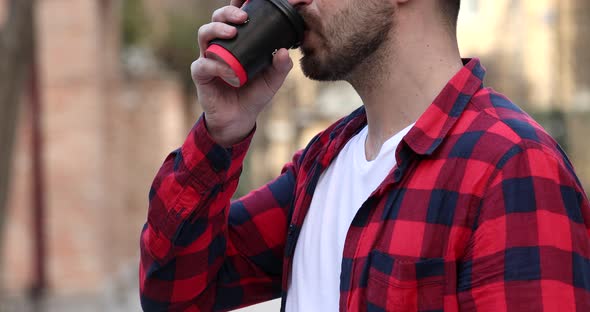 Man holding coffee to take away