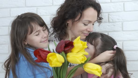Women's Day. Happy family with flowers.  alt