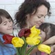 Women&#39;s Day. Happy family with flowers. - VideoHive Item for Sale