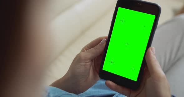 Woman Holding Greenscreen Smartphone