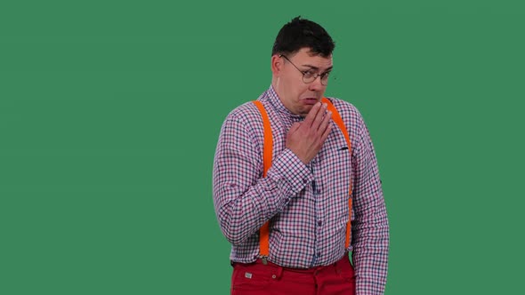 The Unpleasantly Shocked Man Covers His Mouth with His Hand and Shows Disgust alt