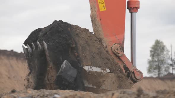 Close-up of an Excavator Bucket Digging