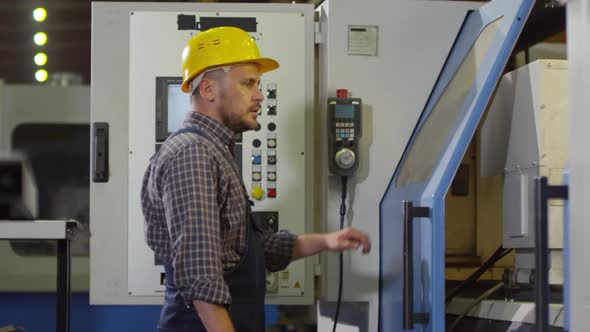 Automated Lathe Operator Busy at Work alt