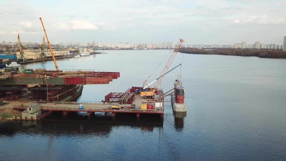 Aerial Shot of Construction of Bridge of a New Highway Across River alt