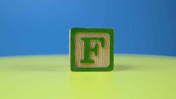 Close up shot letter "F" alphabet wooden block alt