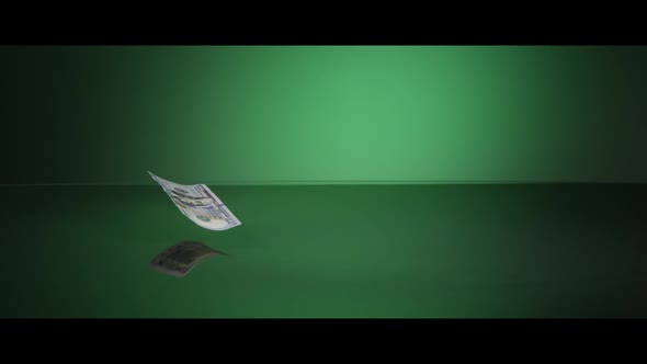 American $100 Bills Falling onto a Reflective Surface - MONEY 0023 alt