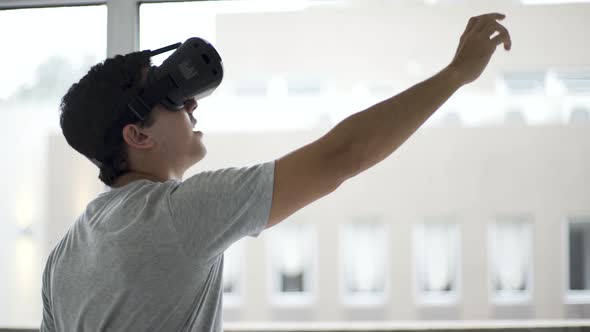 Teenage student wearing virtual reality glasses