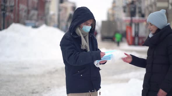 Volunteers Give People Free Medical Face Masks To Protect Against the Virus