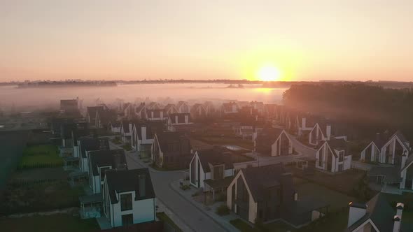 Townhouse at Dawn with Fog That Hangs in Layers. Light Haze. Oak Forest, Field, Sunrise